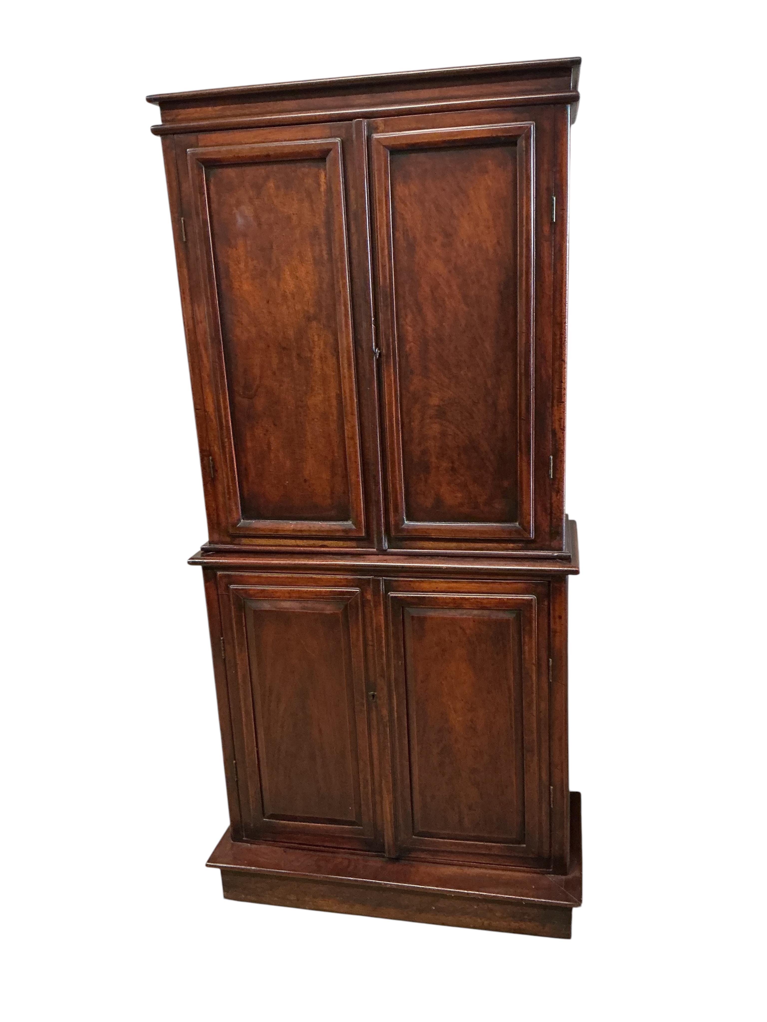 An early Victorian mahogany household cupboard, width 89cm, depth 35cm, height 187cm